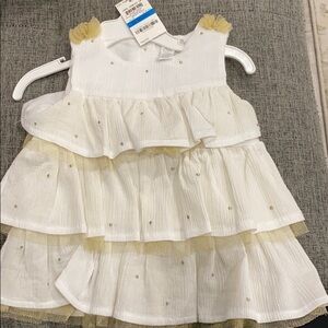 First Impressions white and gold dress in size 23 months. NWT